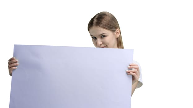 A woman, close-up, on a white background, shows a white sheet.