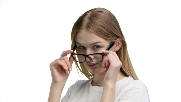 Woman, close-up, on a white background, wearing glasses.