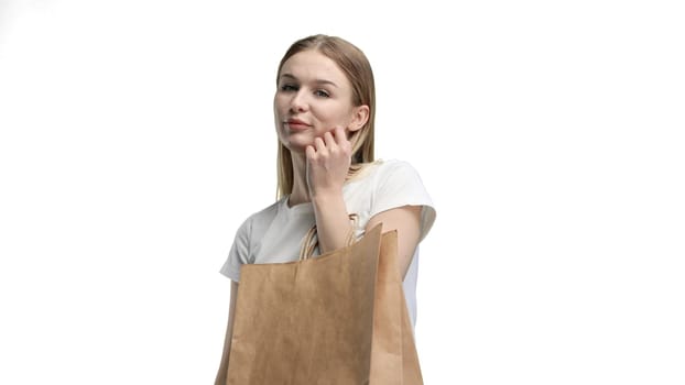 Woman, close-up, on a white background, with bags.