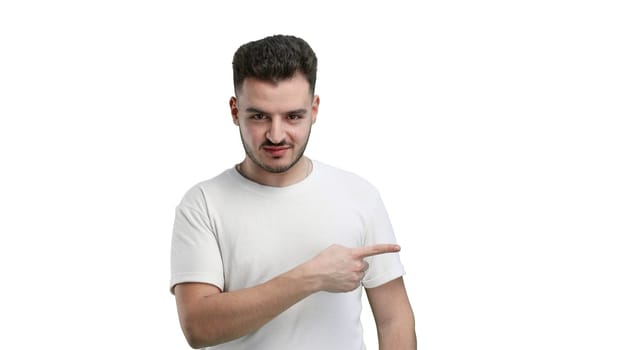 A man, close-up, on a white background, points to the side.