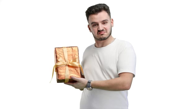 Man, close-up, on a white background, with a gift.