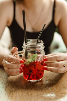 Berry lemonade in glass jar with Peppermint