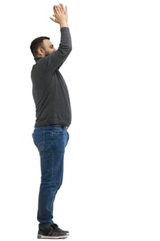 A man, full-length, on a white background, claps.
