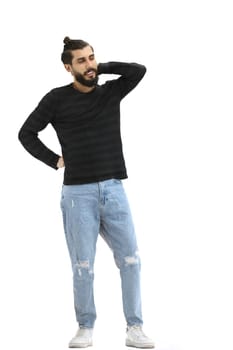 A man, full-length, on a white background, scratches the back of his head.