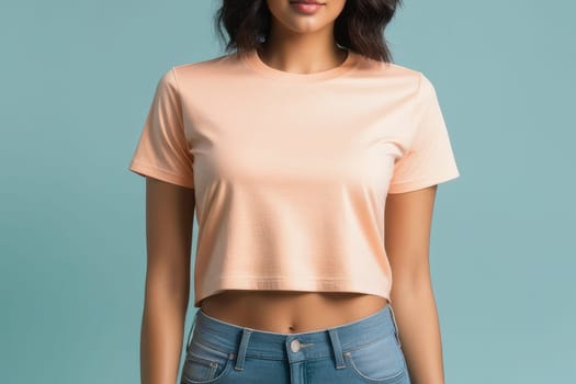 Woman in peach fuzz colored tshirt, can be used for design, mock up. The trending color of 2024