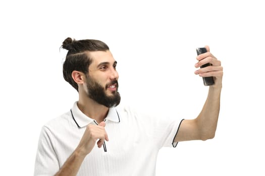 Man, close-up, on a white background, with a phone.