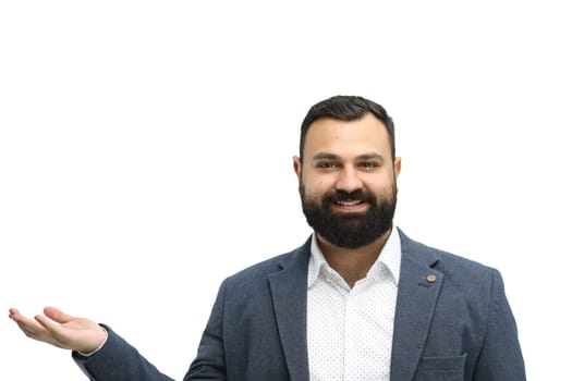 A man, close-up, on a white background, points to the side.