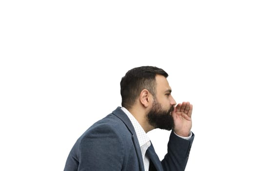 A man, close-up, on a white background, tells a secret.