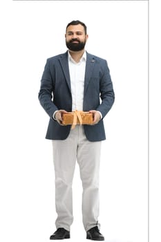A man, full-length, on a white background, with a gift.