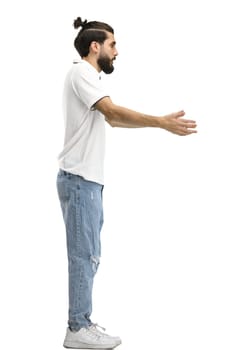 A man, full-length, on a white background, spreads his arms.