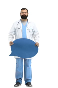 Male doctor, full-length, on a white background, shows a blue comment sign.