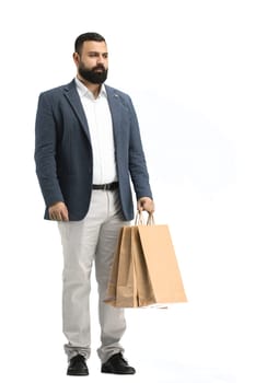 A man, full-length, on a white background, with bags.