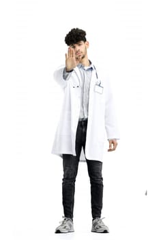 Male doctor, full-length, on a white background, shows a stop sign.
