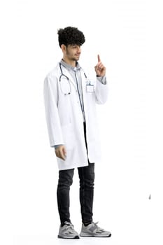 A male doctor, full-length, on a white background, shows an important sign.