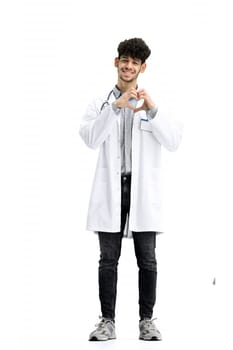 Male doctor, full-length, on a white background, shows a heart.