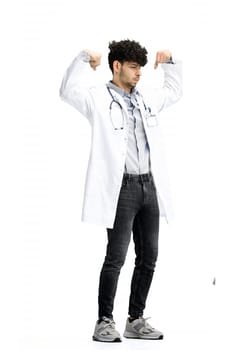 Male doctor, full-length, on a white background, shows strength.