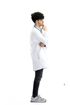 A male doctor, full-length, on a white background, thinks.