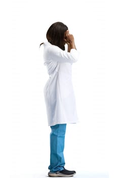 Female doctor, full-length, on a white background, tired.