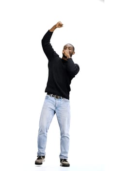 A man, full-length, on a white background, rejoices.