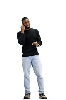 A man, full-length, on a white background, talking on the phone.