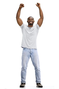 A man, full-length, on a white background, raised his hands up.