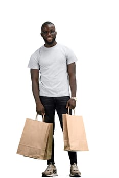 A man, full-length, on a white background, with bags.