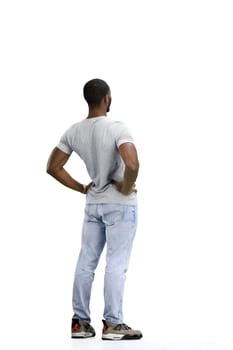 A man, full-length, on a white background, warming up.