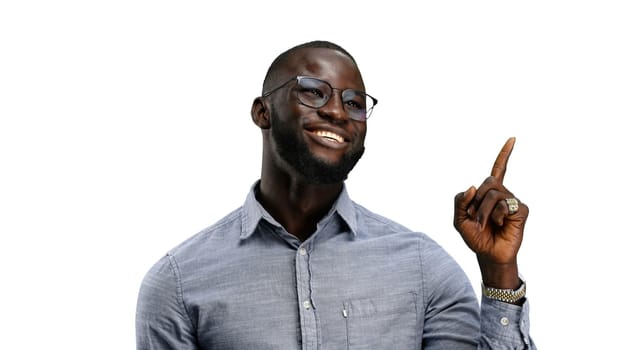 Man, close-up, on a white background, pointing up.