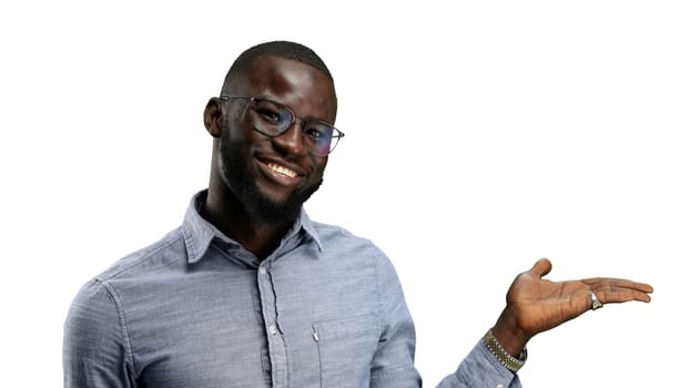 A man, close-up, on a white background, points to the side.