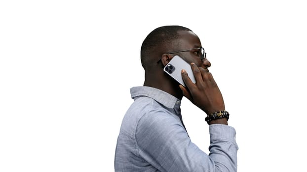 Man, close-up, on a white background, talking on the phone.
