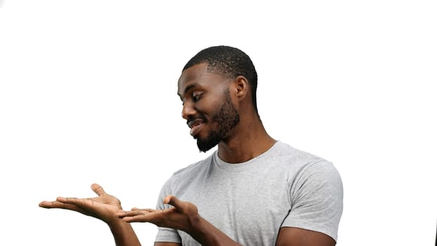 A man, close-up, on a white background, points to the side.