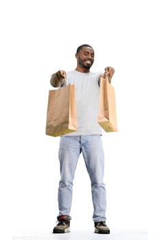 A man, full-length, on a white background, with bags.