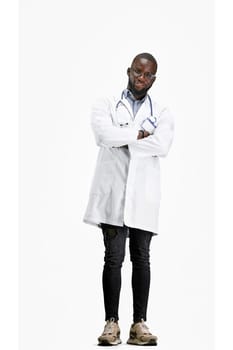The doctor, in full height, on a white background, crossed his arms.