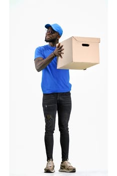 The deliveryman, full-length, on a white background, with a box.