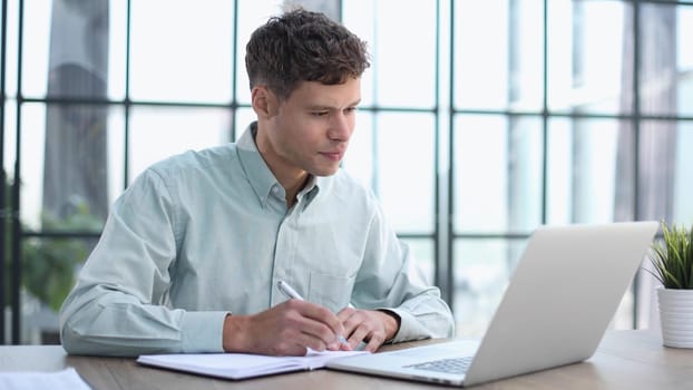 Modern Office: Portrait of Stylish Hispanic Businessman Works on Laptop