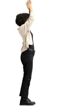 A woman, full-length, on a white background, claps.