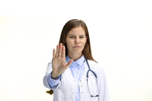 Female doctor, close-up, on a white background, shows a stop sign.