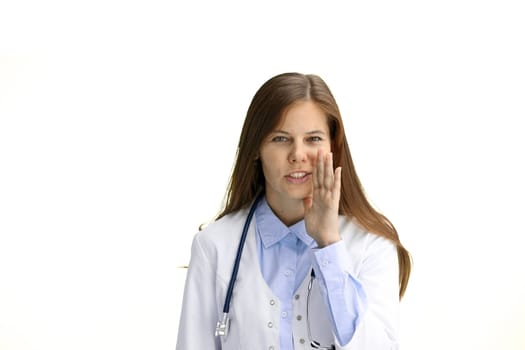 Female doctor, close-up, on a white background, tells a secret.