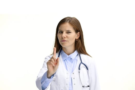 Female doctor, close-up, on a white background, shows an important sign.