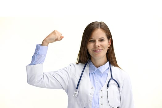 Female doctor, close-up, on a white background, shows strength.