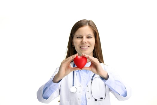 Female doctor, close-up, on a white background, shows a heart.