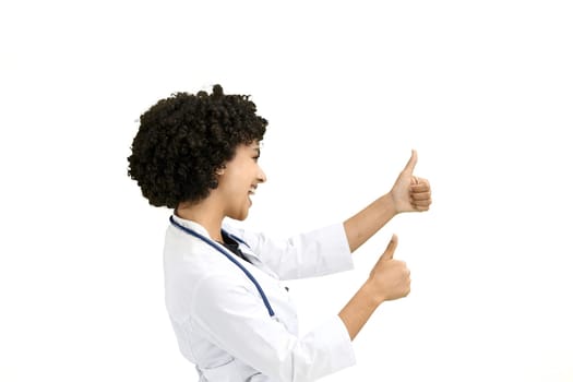 Female doctor, close-up, on a white background, shows thumbs up.