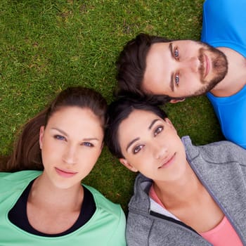 Nature, fitness and portrait of friends on grass for exercise, workout and healthy lifestyle from high angle. Sports, health and face of people outdoors for bonding, connection or break for training.