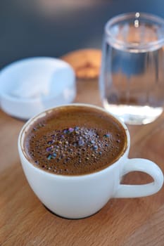 a cup of turkish coffee on table .