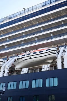 Cruise ship with the river pilots boat attached. Close up