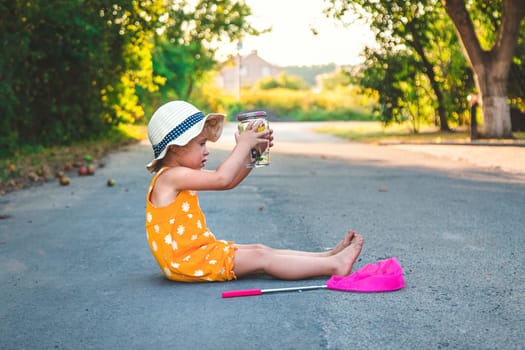 A child catches a butterfly in nature. selective focus. kid.