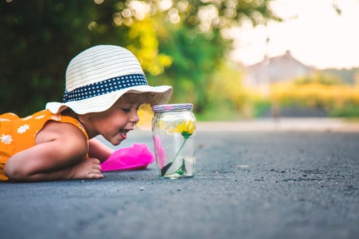 A child catches a butterfly in nature. selective focus. kid.