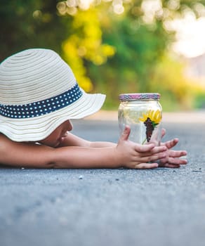 A child catches a butterfly in nature. selective focus. kid.