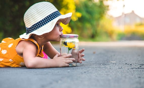 A child catches a butterfly in nature. selective focus. kid.