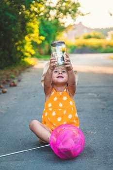 A child catches a butterfly in nature. selective focus. kid.